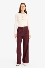 High-waisted, regular length trousers with three pockets and wide legs