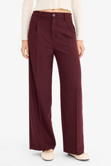 High-waisted, regular length trousers with three pockets and wide legs