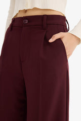 High-waisted, regular length trousers with three pockets and wide legs