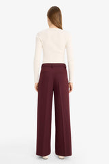 High-waisted, regular length trousers with three pockets and wide legs