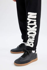 Girls Printed Black Jogger Sweatpants with Elastic Waistband