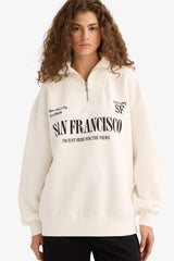 Oversized wide fit sweatshirt with a printed half-zip