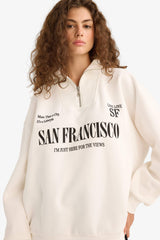 Oversized wide fit sweatshirt with a printed half-zip