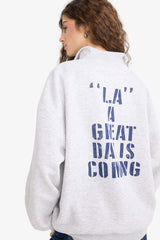 Oversized wide fit sweatshirt with a printed half-zip