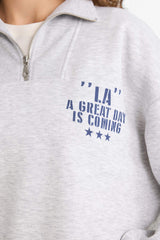 Oversized wide fit sweatshirt with a printed half-zip