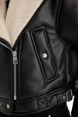 Oversize, loose-fitting faux leather jacket with faux fur lining and zipper closure.