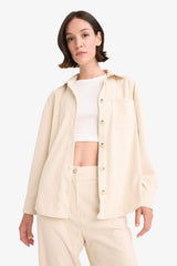 Loose corduroy shirt with a shirt collar and long sleeves