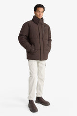 Water-repellent, regular fit, stand-collar jacket with inner zippered pockets.