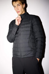 Water-repellent goose down jacket with slim fit, narrow cut, stand-collar, inner pocket detail, and zippered pockets.