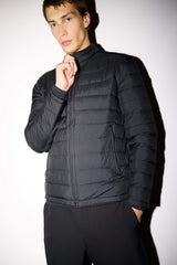 Water-repellent goose down jacket with slim fit, narrow cut, stand-collar, inner pocket detail, and zippered pockets.