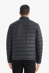 Water-repellent goose down jacket with slim fit, narrow cut, stand-collar, inner pocket detail, and zippered pockets.