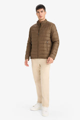 Water-repellent goose down jacket with slim fit, narrow cut, stand-collar, inner pocket detail, and zippered pockets.