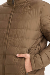 Water-repellent goose down jacket with slim fit, narrow cut, stand-collar, inner pocket detail, and zippered pockets.