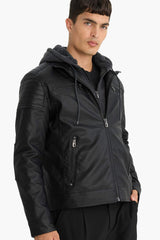 Water-repellent, slim-fit, narrow-cut faux leather jacket with removable hood, plush lining, and zip closure.