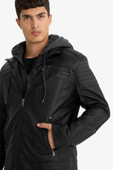 Water-repellent, slim-fit, narrow-cut faux leather jacket with removable hood, plush lining, and zip closure.