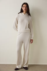 Off-white hooded sweatshirt with knitted detail.