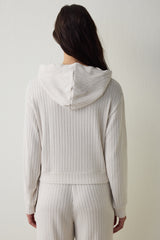 Off-white hooded sweatshirt with knitted detail.