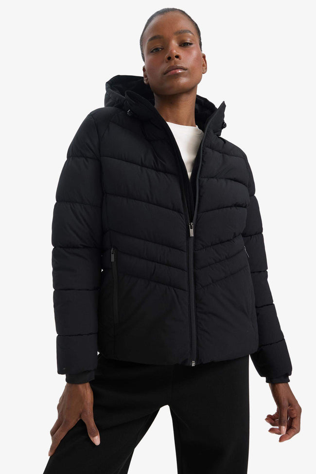 Water-repellent, regular-fit hooded jacket with zip-up pockets. Hover Image