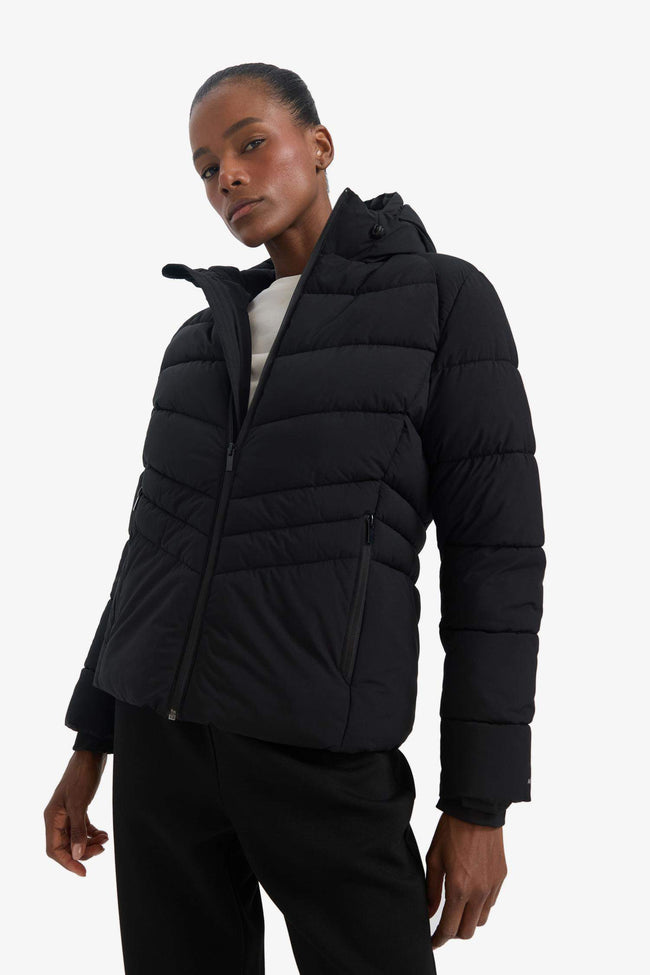 Water-repellent, regular-fit hooded jacket with zip-up pockets. Main Image