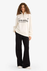 Oversized wide fit sweatshirt with a printed half-zip