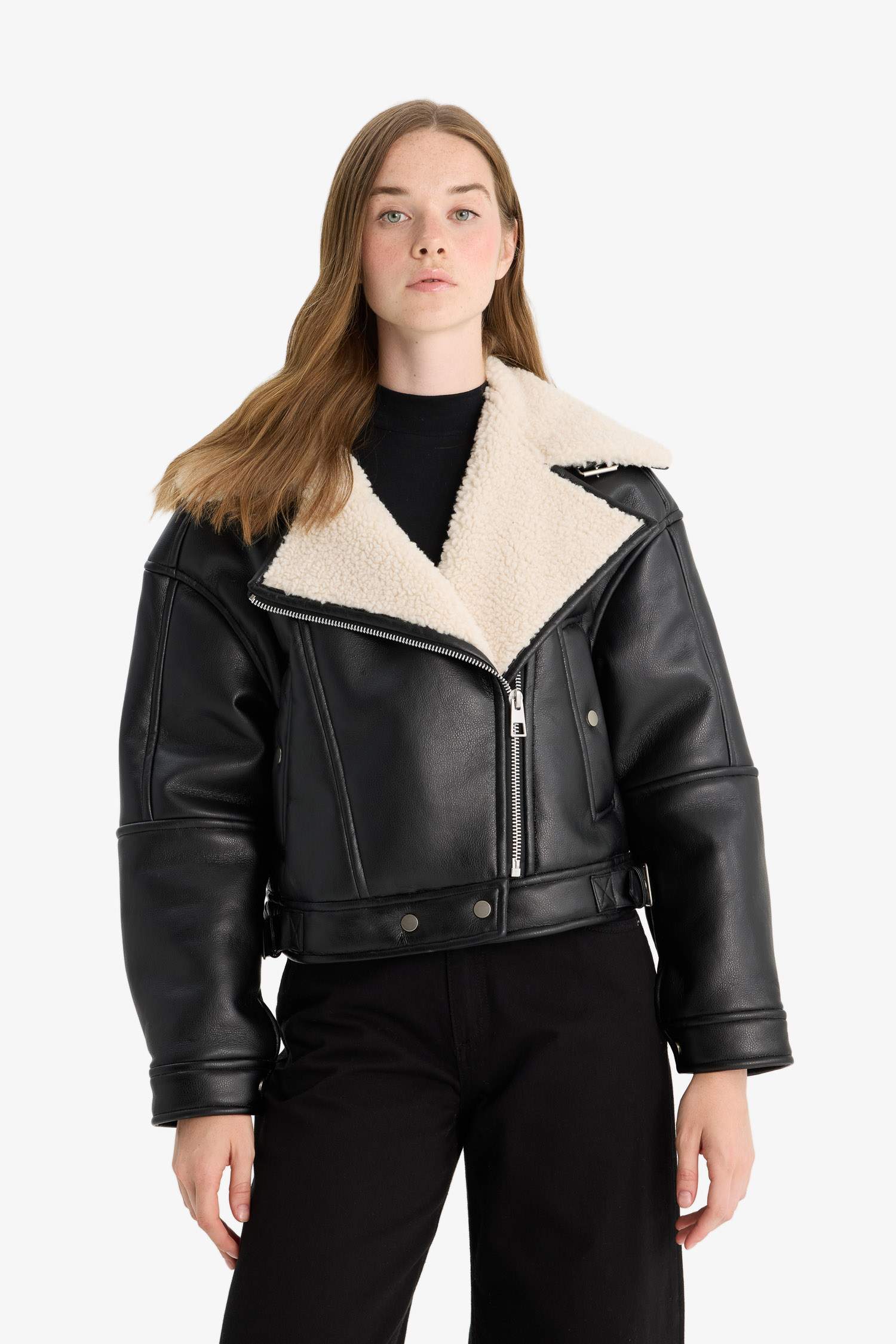 Oversize, loose-fitting faux leather jacket with faux fur lining and zipper closure.