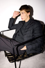 Water-repellent goose down jacket with slim fit, narrow cut, stand-collar, inner pocket detail, and zippered pockets.