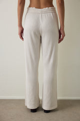 Off-white high-waisted trousers with knitted detail.